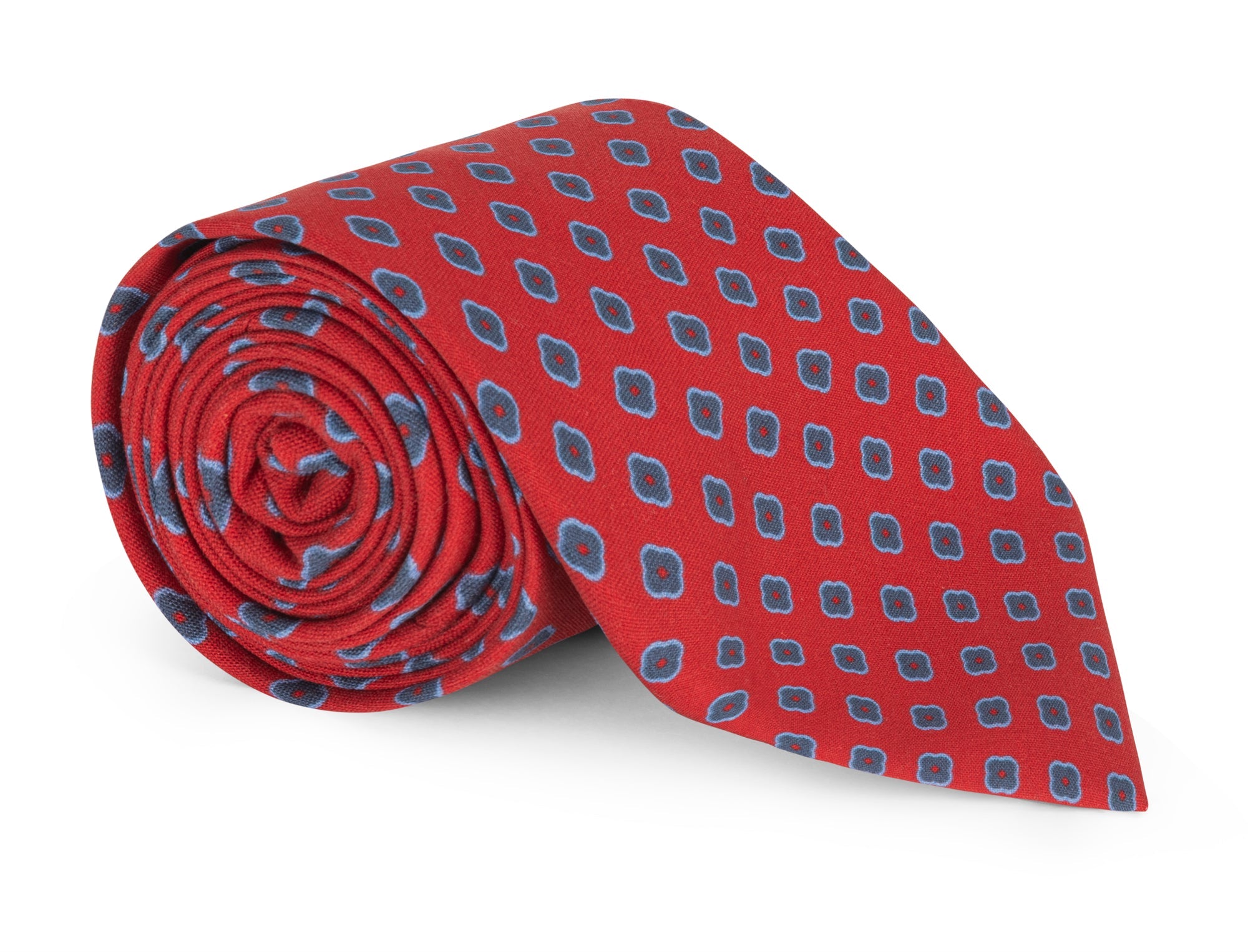 Red foulard silk necktie photographed flat against a neutral ground