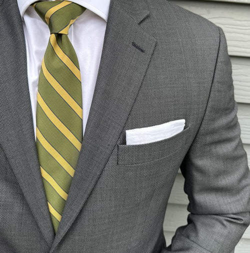 Olive green mogador striped necktie photographed flat on a light surface