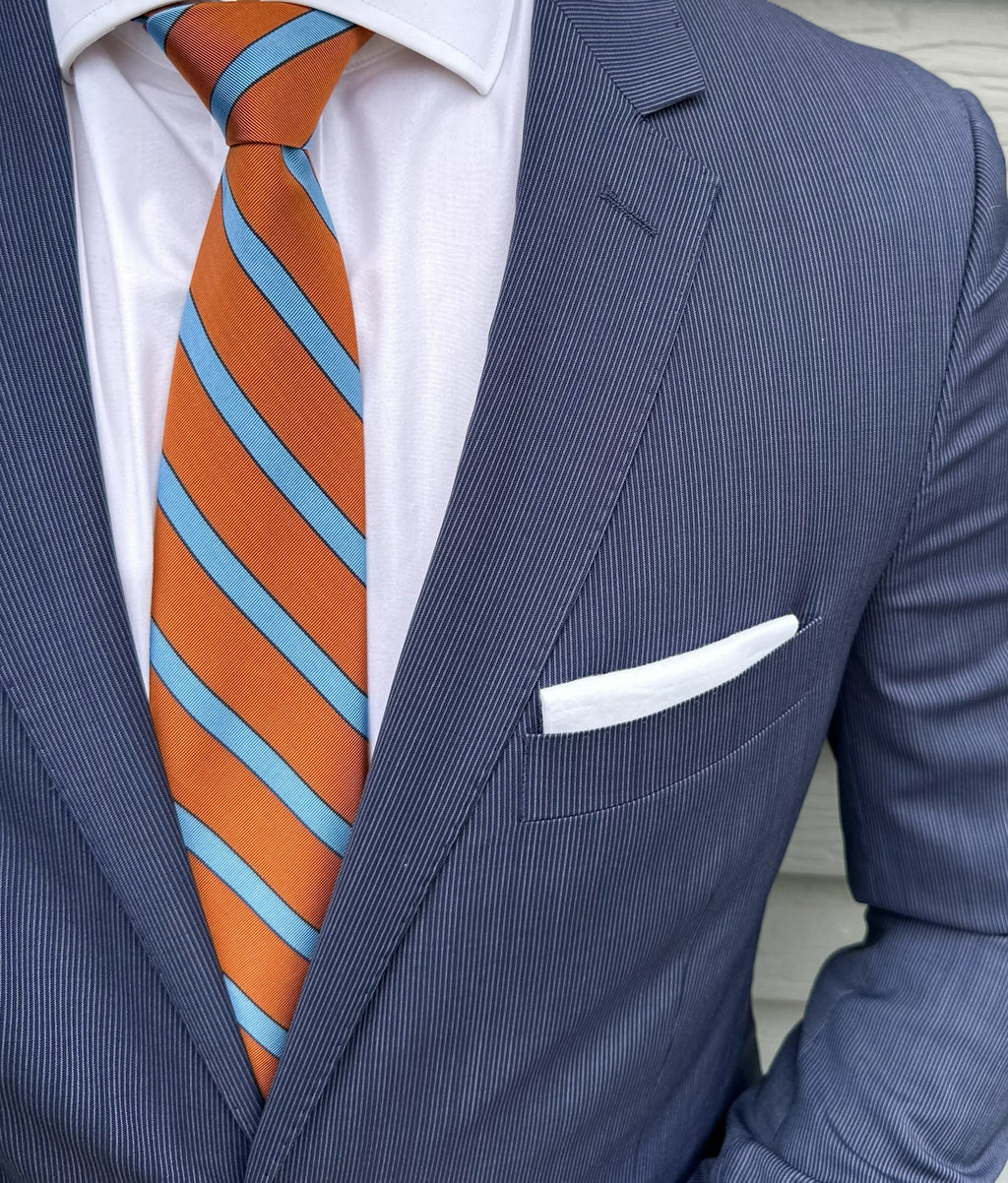 Orange mogador striped necktie shown knotted, textured matte weave