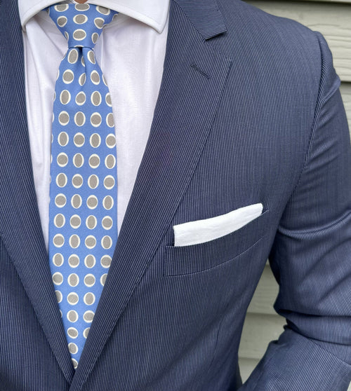 Oval motif detail on soft sky blue woven silk