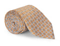 Orange and blue geometric jacquard silk necktie shown in close detail