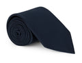 Plain navy silk necktie shown knotted against a pale background