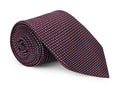 Wine red semi-solid silk necktie shown close up, subtle weave detail