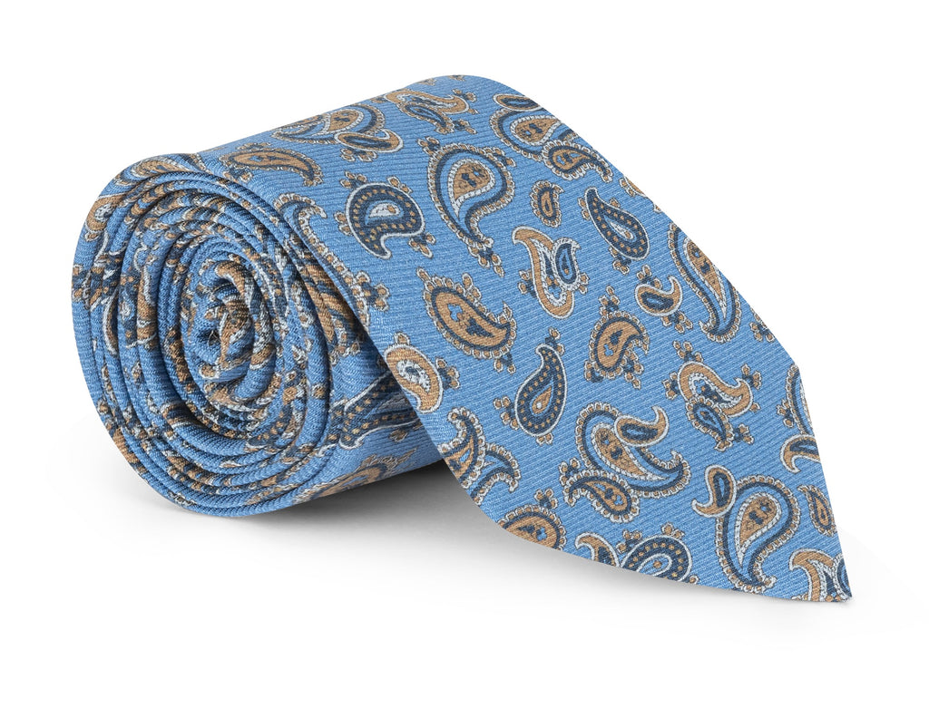 Light blue paisley silk necktie laid flat, paisley repeat in view