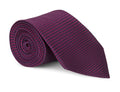 Berry red semi-solid silk necktie shown close up, subtle woven texture