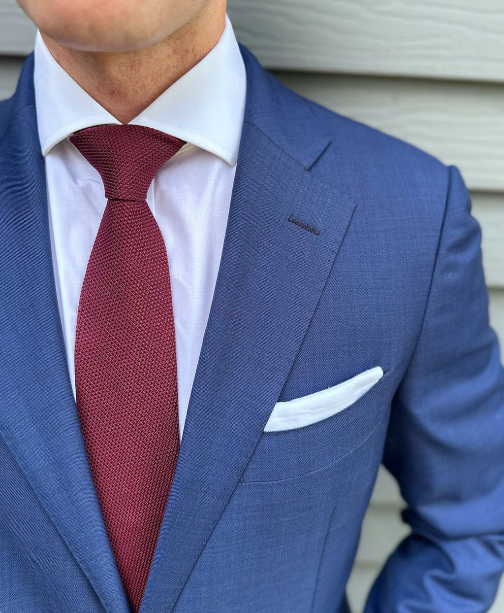 Deep wine red grenadine silk necktie with visible open weave texture