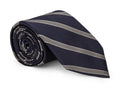 Navy striped silk necktie laid flat with the stripe repeat in view